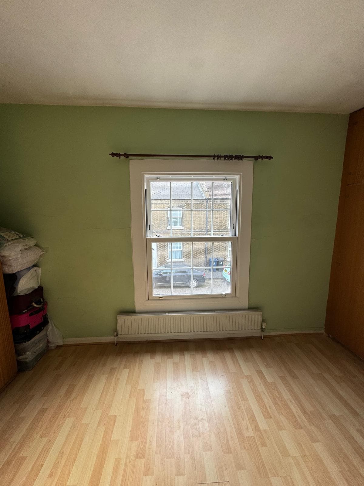 Sliding sash window in an empty room, London terrace